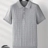 Men’s ribbed polo t-shirt with short sleeves and a slim fit collar.