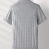 Men’s ribbed polo t-shirt with short sleeves and a slim fit collar.