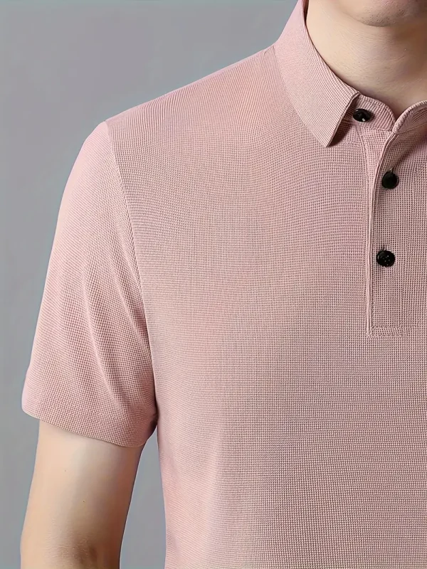 Men’s pink polo t-shirt with short sleeves and classic collar.